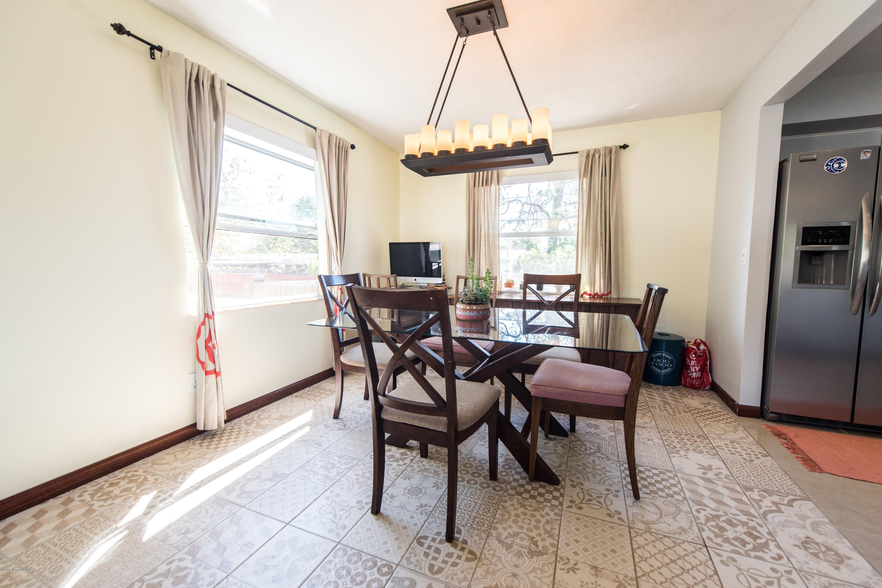 1023 Palmer Road Rockledge, FL 32955 - Photo 6 of 24 a dining room with furniture and window