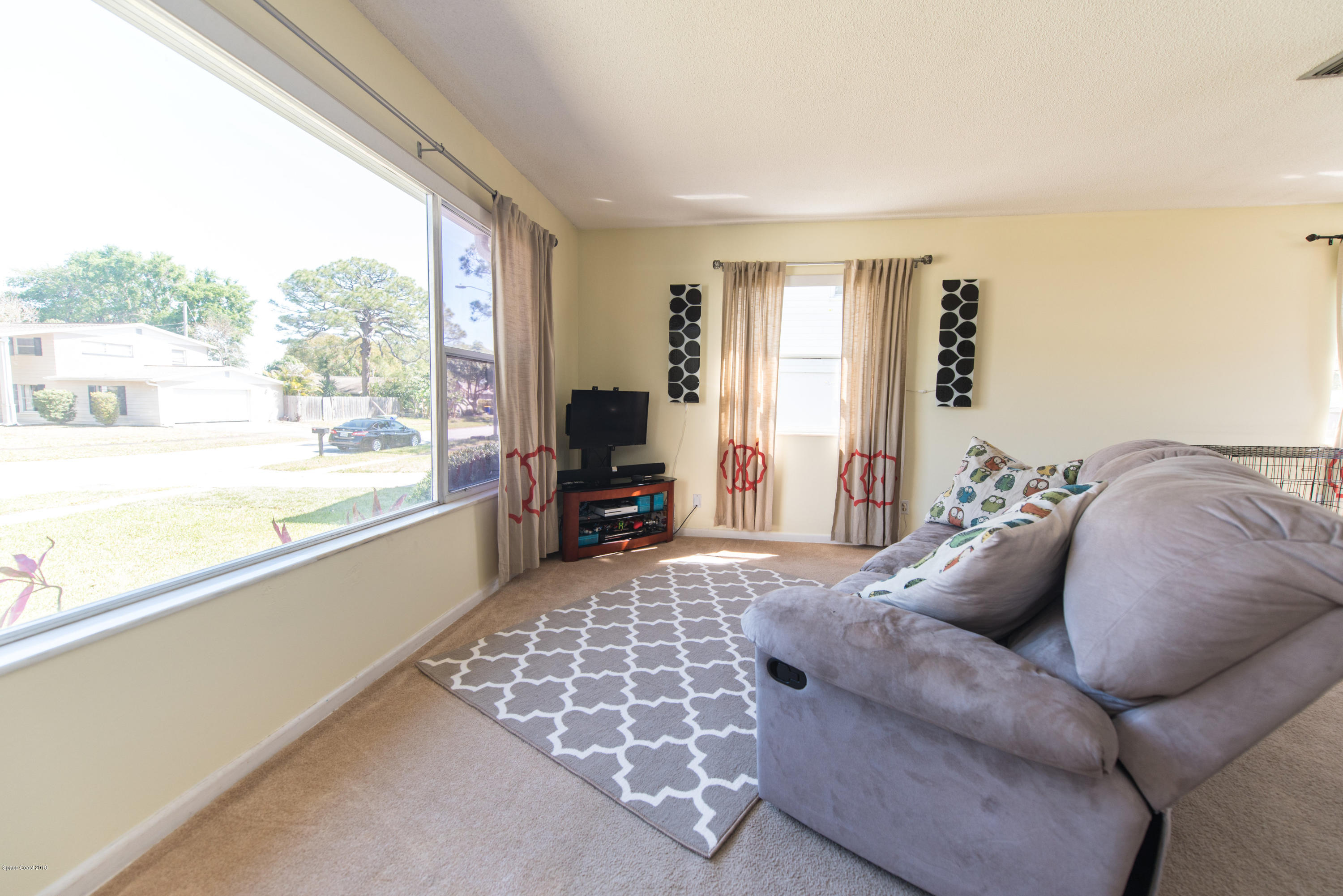 1023 Palmer Road Rockledge, FL 32955 - Photo 8 of 24 a living room with furniture and a large window