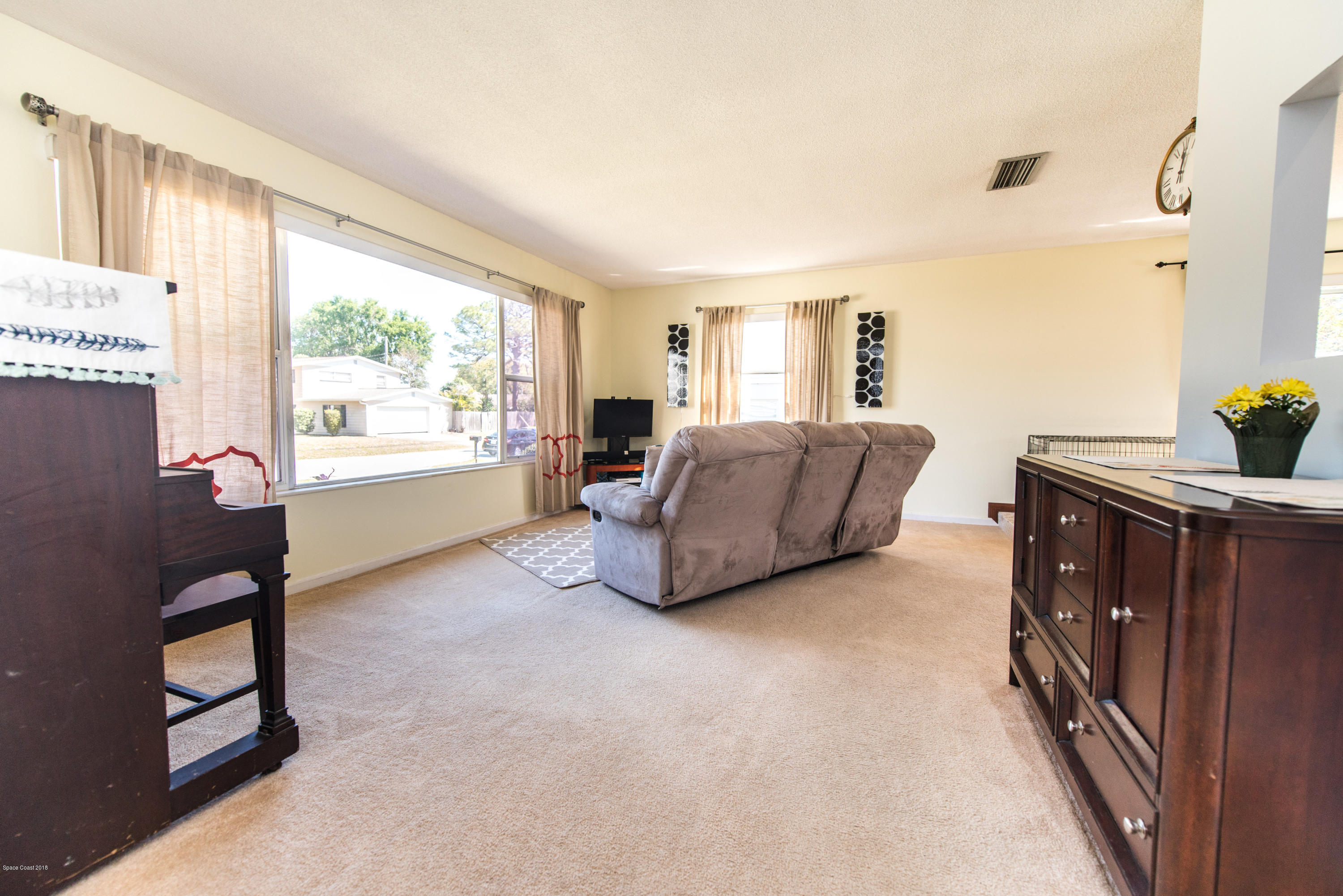 1023 Palmer Road Rockledge, FL 32955 - Photo 9 of 24 a living room with furniture and a window