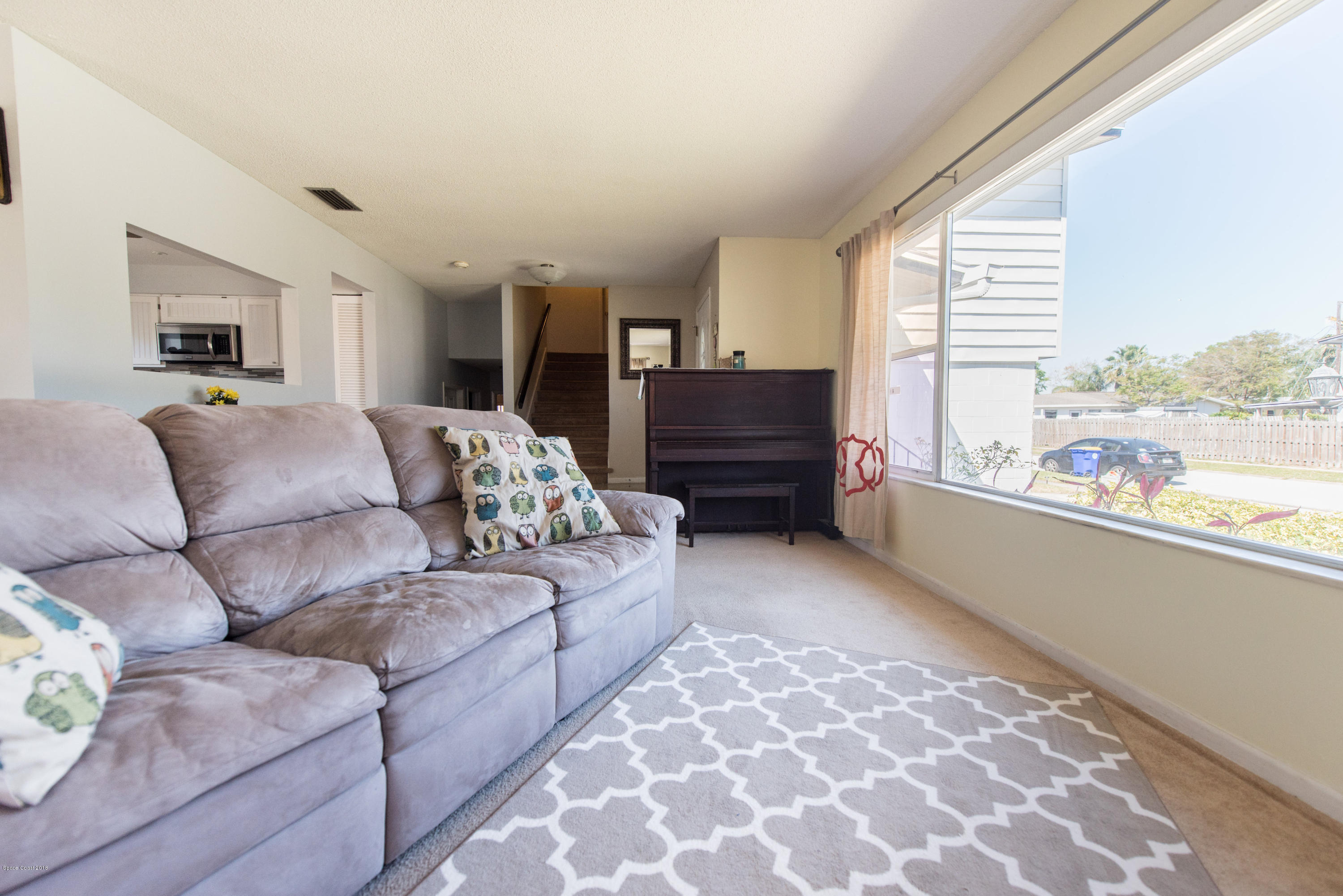 1023 Palmer Road Rockledge, FL 32955 - Photo 10 of 24 a living room with furniture and a large window