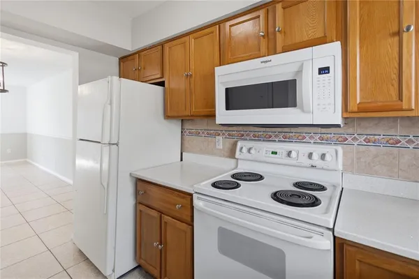 a kitchen with a stove microwave and refrigerator