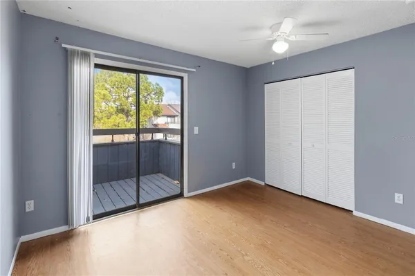 a view of an empty room with glass door