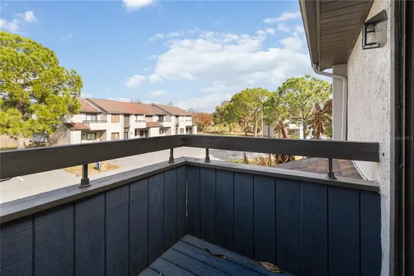 a view of a balcony with an outdoor space
