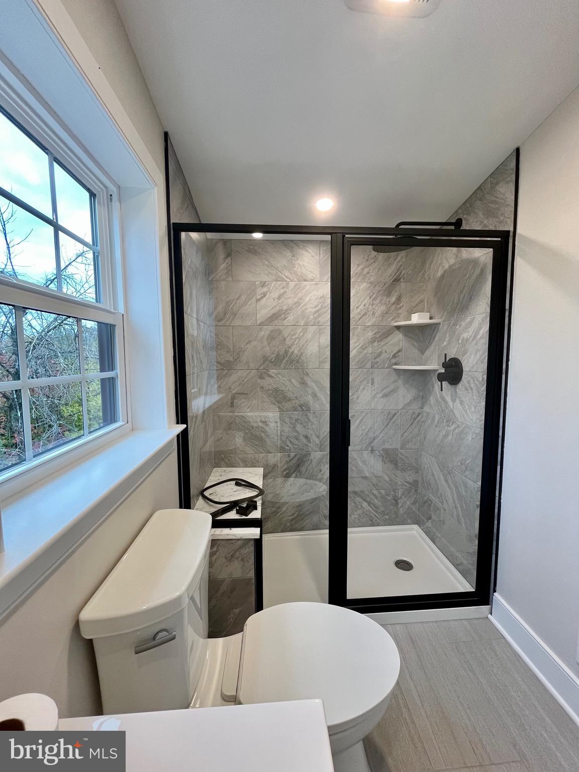 135 Center Hill Road Upper Black Eddy, PA 18972 - Photo 20 of 25 a bathroom with a toilet and a shower