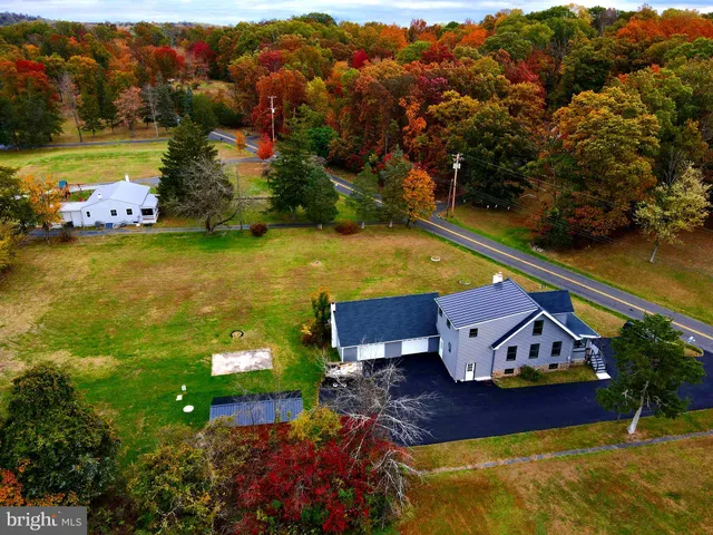 an aerial view of a house with a garden