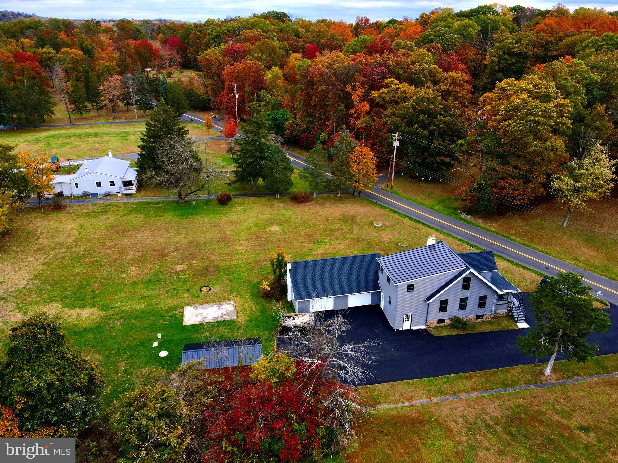 135 Center Hill Road Upper Black Eddy, PA 18972 - Photo 22 of 25 an aerial view of a house with a garden