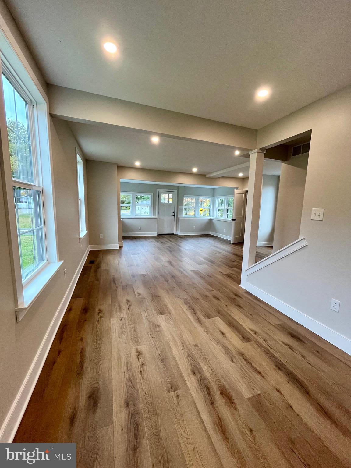 135 Center Hill Road Upper Black Eddy, PA 18972 - Photo 6 of 25 a view of livingroom with an empty space wooden floor and window