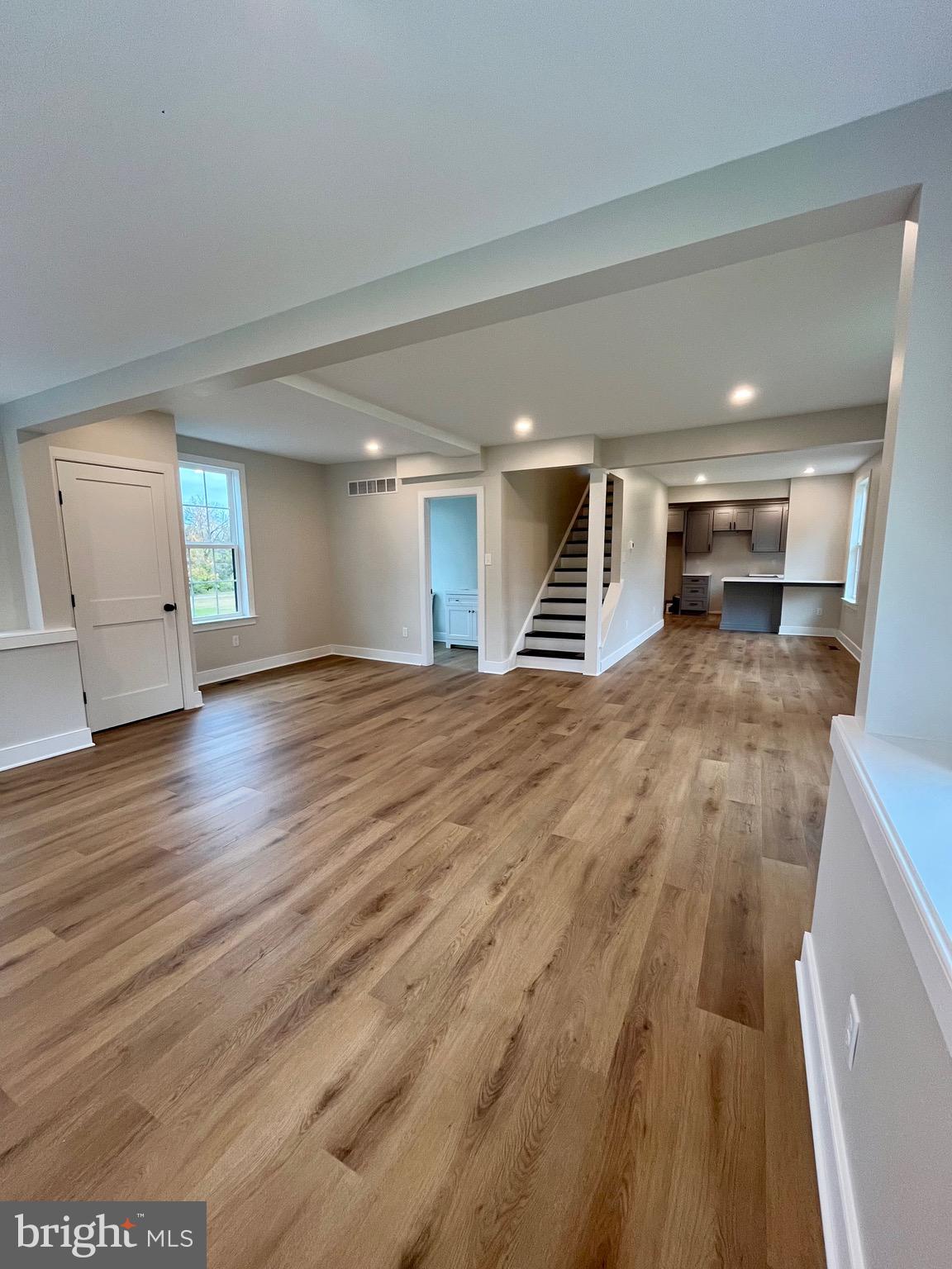 135 Center Hill Road Upper Black Eddy, PA 18972 - Photo 8 of 25 a view of an empty room with wooden floor and a window