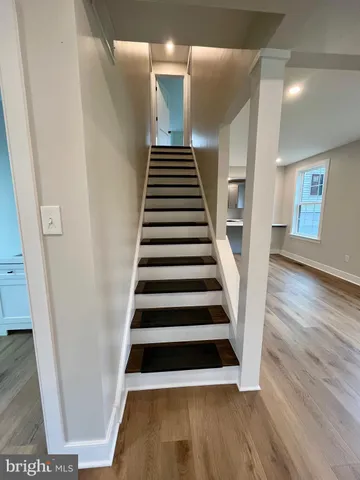 a view of entryway with wooden floor