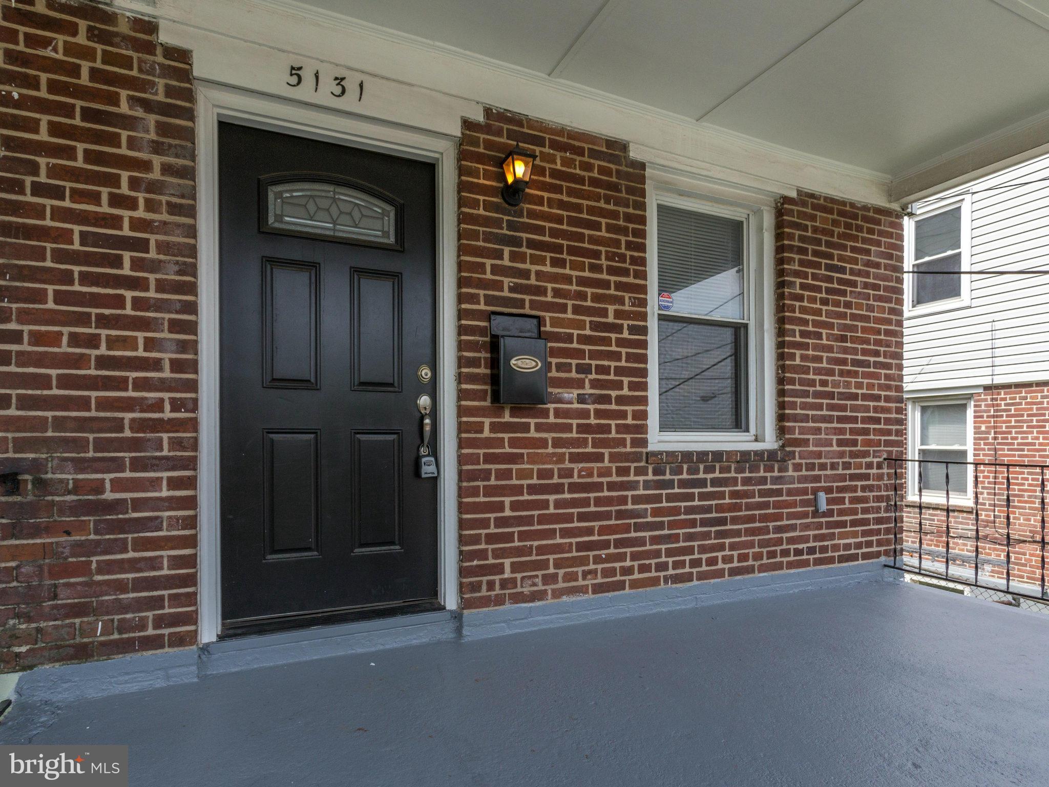 5131 Sheriff Road Northeast Washington, DC 20019 - Photo 2 of 29 a view of a wooden door and a window