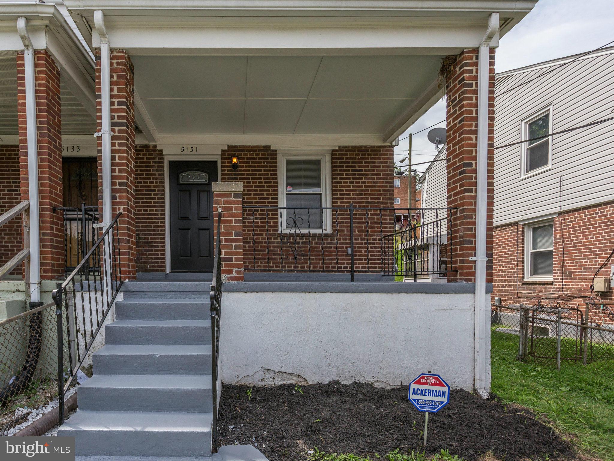 5131 Sheriff Road Northeast Washington, DC 20019 - Photo 3 of 29 a front view of a house with a yard