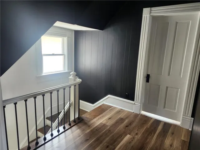 a view of entryway with wooden floor