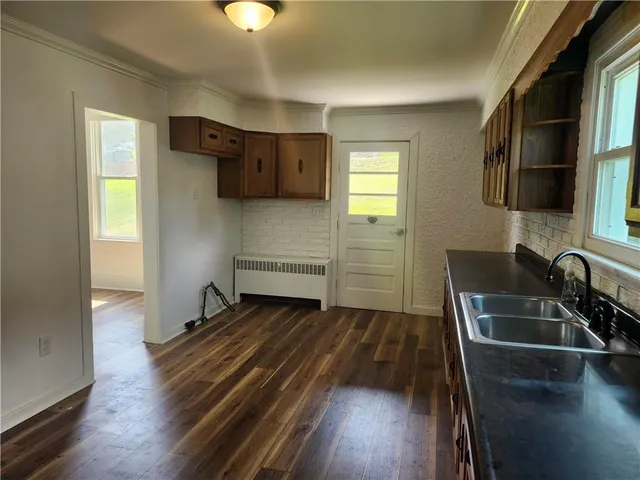 a kitchen with wooden cabinets and a sink