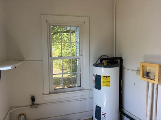 a bathroom with a sink and a window