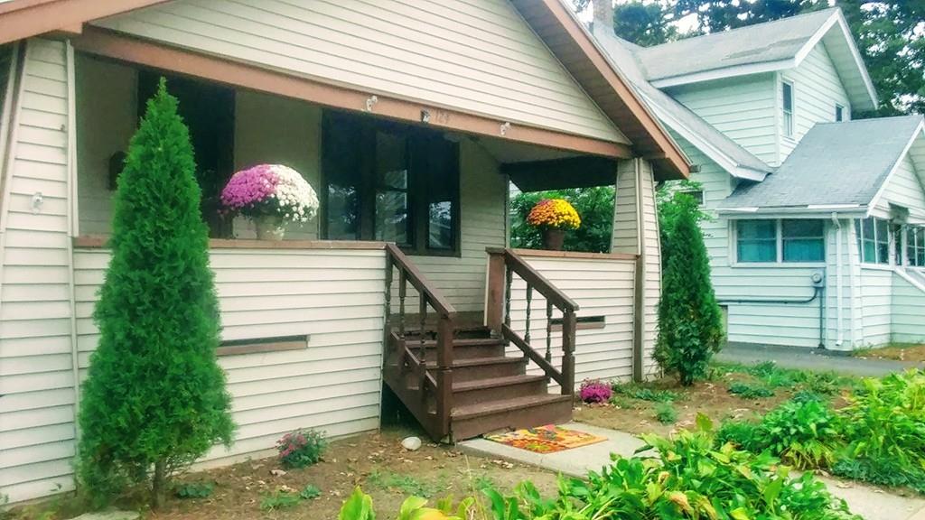 124 Phoenix Terrace Springfield, MA 01104 - Photo 1 of 17 a front view of a house with plants