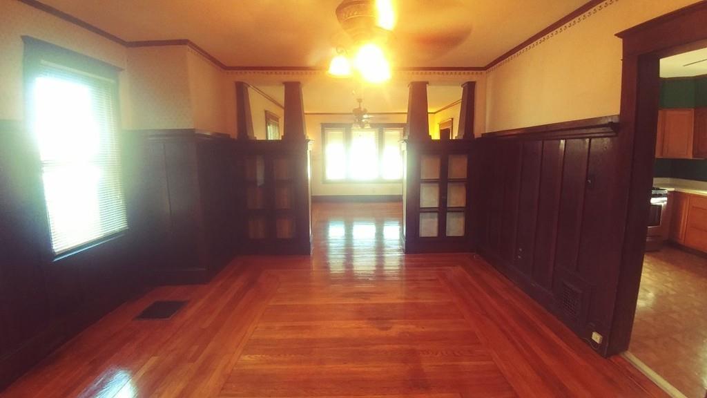 124 Phoenix Terrace Springfield, MA 01104 - Photo 3 of 17 a view of empty room with wooden floor and fan