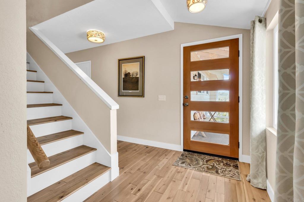 13501 Melissa Lane Poway, CA 92064 - Photo 11 of 62 a view of a door with wooden floor and a window