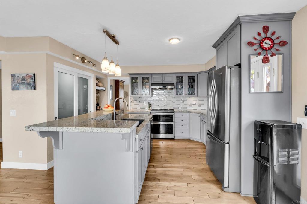 13501 Melissa Lane Poway, CA 92064 - Photo 15 of 62 a kitchen with stainless steel appliances granite countertop a refrigerator and a sink