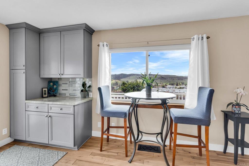 13501 Melissa Lane Poway, CA 92064 - Photo 17 of 62 a view of a dining room with furniture window and wooden floor