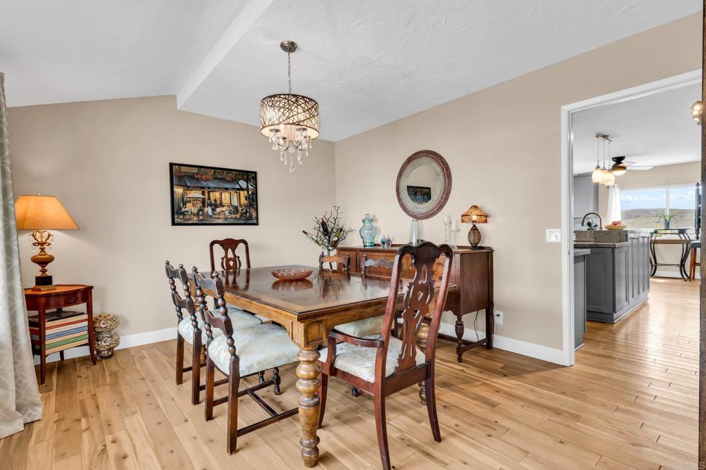 13501 Melissa Lane Poway, CA 92064 - Photo 19 of 62 a view of a dining room with furniture and wooden floor