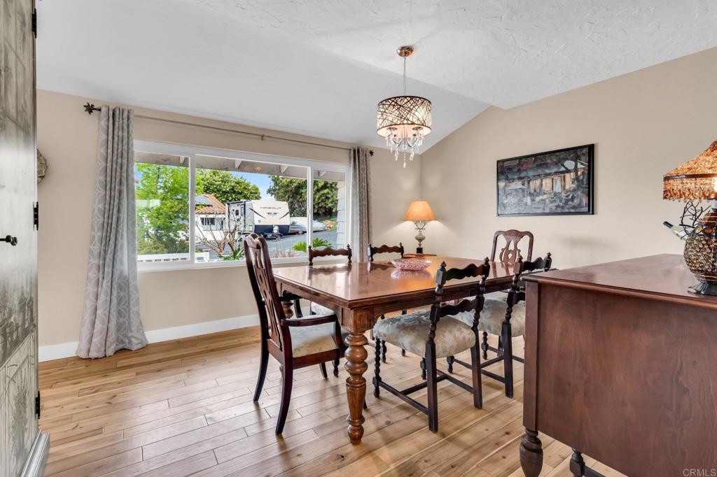 13501 Melissa Lane Poway, CA 92064 - Photo 20 of 62 a view of a dining room that has a table and chairs