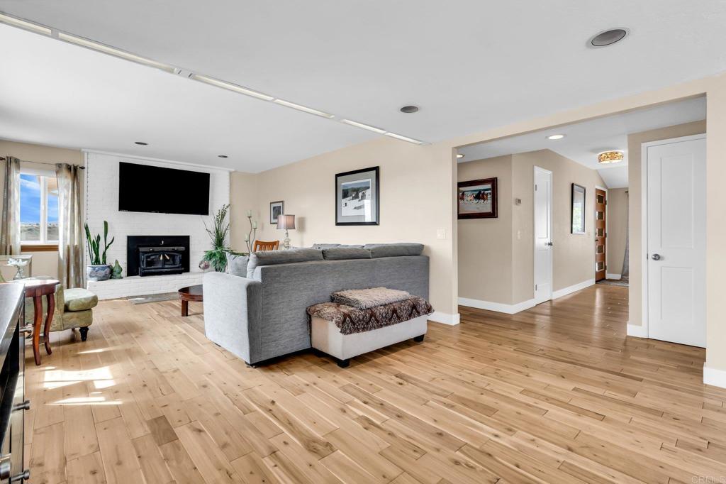 13501 Melissa Lane Poway, CA 92064 - Photo 21 of 62 a living room with furniture a flat screen tv and a fireplace