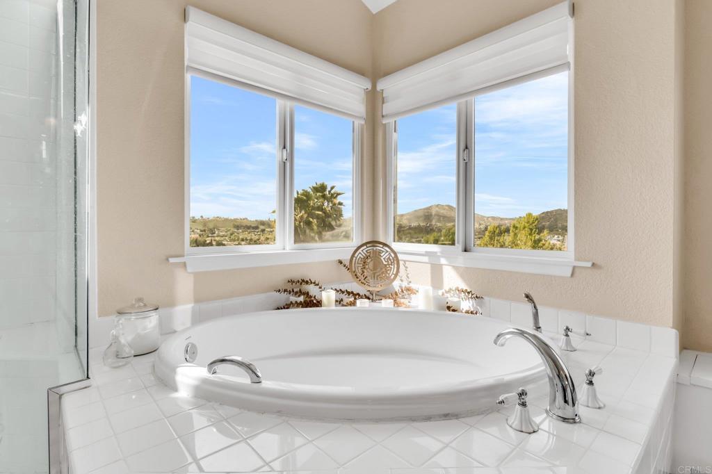 13501 Melissa Lane Poway, CA 92064 - Photo 29 of 62 a bath tub sitting in a bathroom next to a window