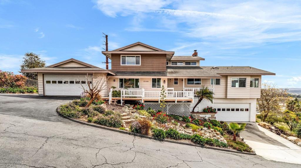 13501 Melissa Lane Poway, CA 92064 - Photo 3 of 62 a front view of a house with a garden