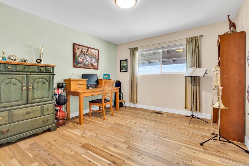 13501 Melissa Lane Poway, CA 92064 - Photo 31 of 62 a view of a workspace with furniture and wooden floor