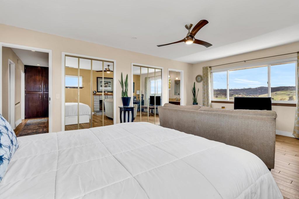 13501 Melissa Lane Poway, CA 92064 - Photo 34 of 62 a large bedroom with a bed and a large mirror
