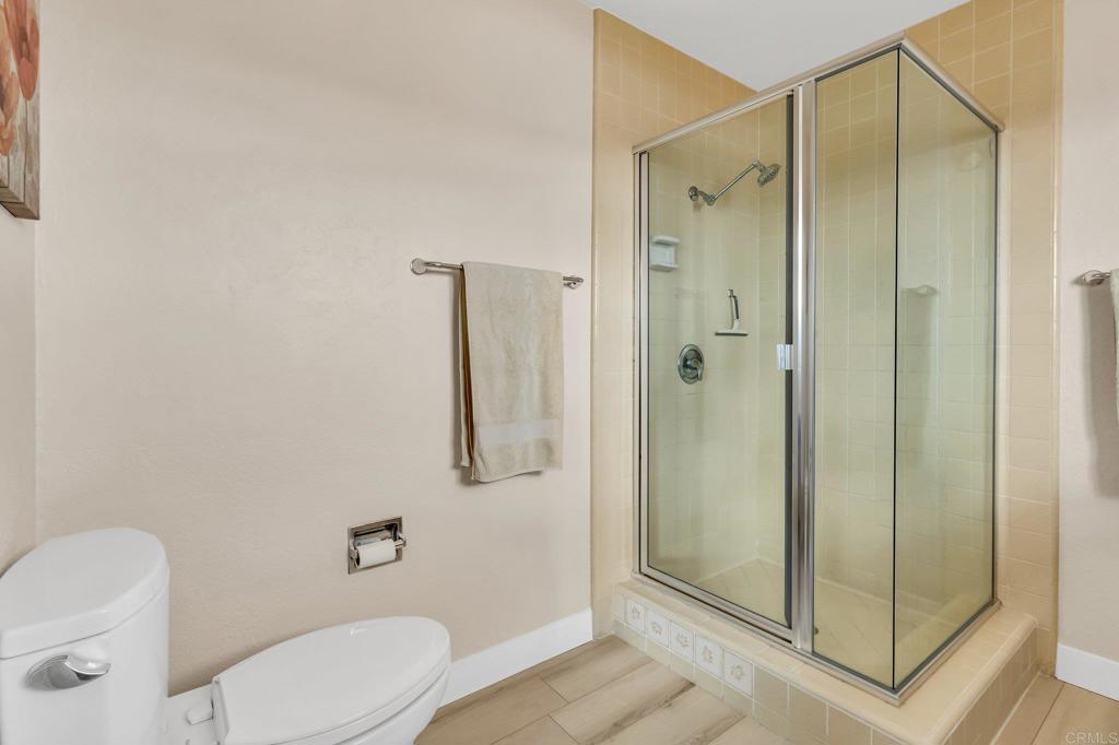 13501 Melissa Lane Poway, CA 92064 - Photo 37 of 62 a bathroom with a shower a toilet and a sink