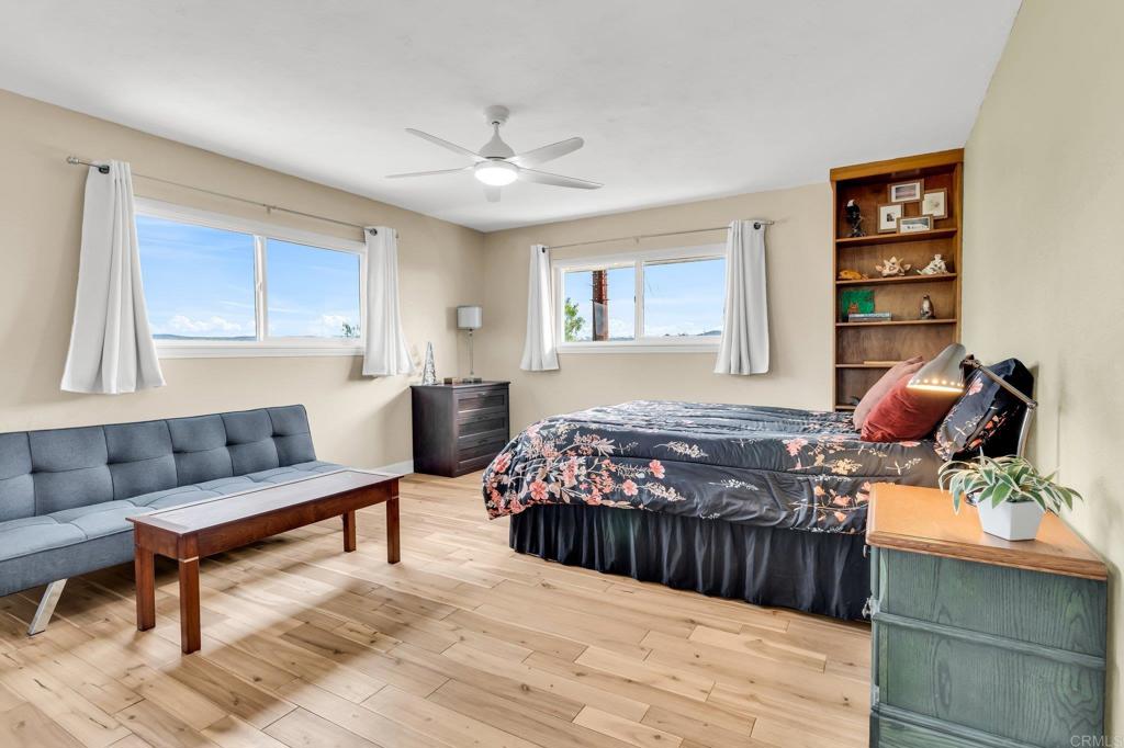 13501 Melissa Lane Poway, CA 92064 - Photo 38 of 62 a bedroom with a bed window and couch
