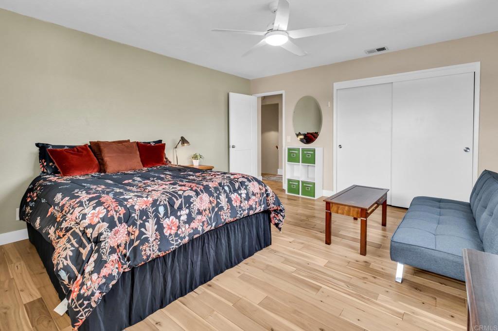 13501 Melissa Lane Poway, CA 92064 - Photo 39 of 62 a bedroom with bed and wooden floor