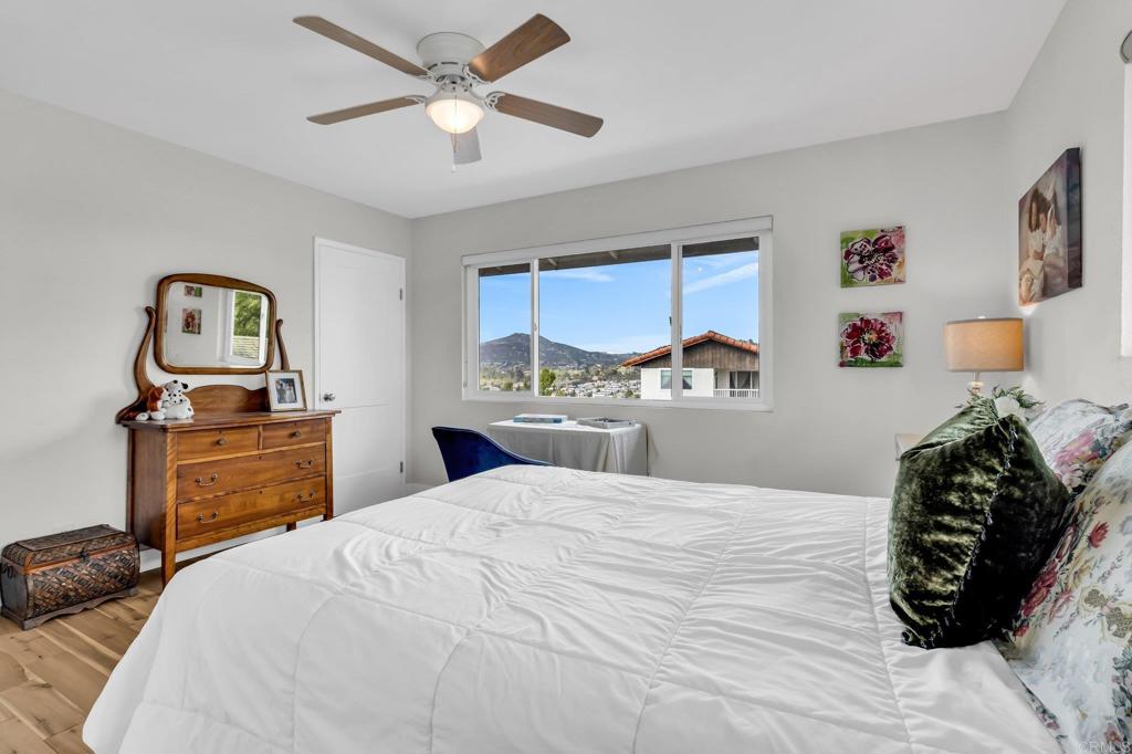 13501 Melissa Lane Poway, CA 92064 - Photo 41 of 62 a bedroom with a bed and dresser with mirror