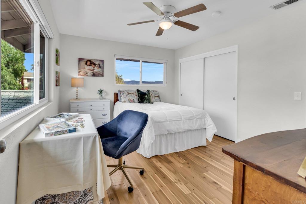 13501 Melissa Lane Poway, CA 92064 - Photo 42 of 62 a bedroom with a bed and a chair