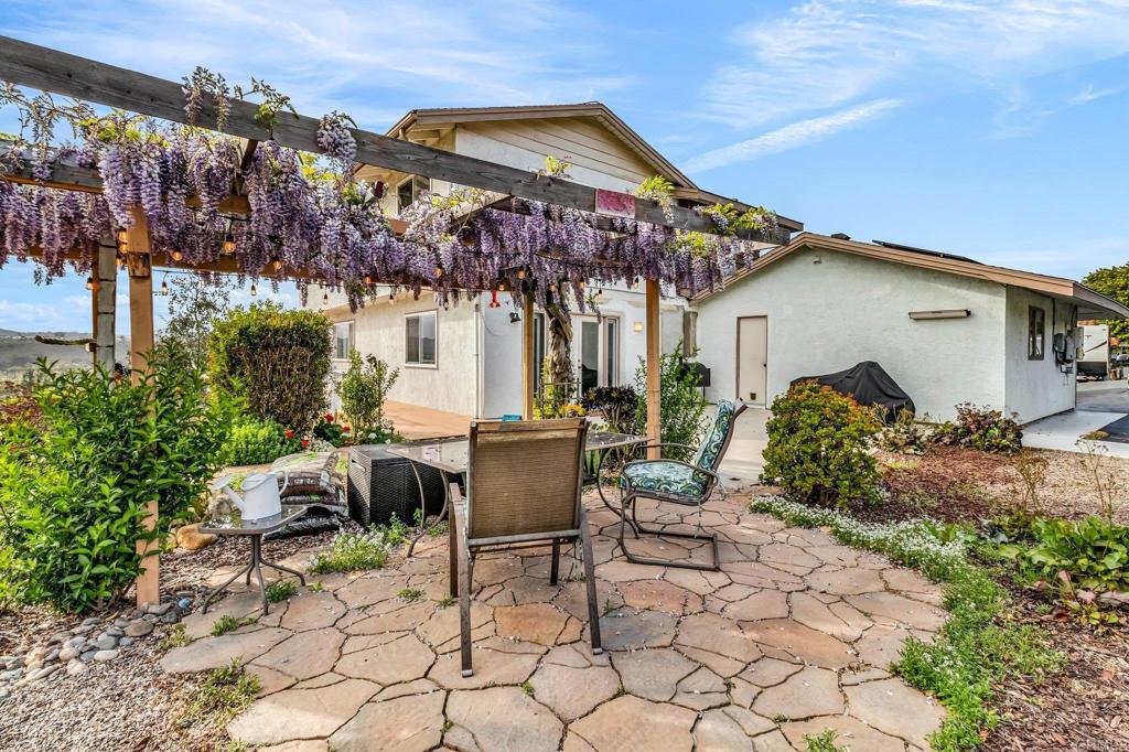 13501 Melissa Lane Poway, CA 92064 - Photo 48 of 62 a view of a chairs and table in a backyard