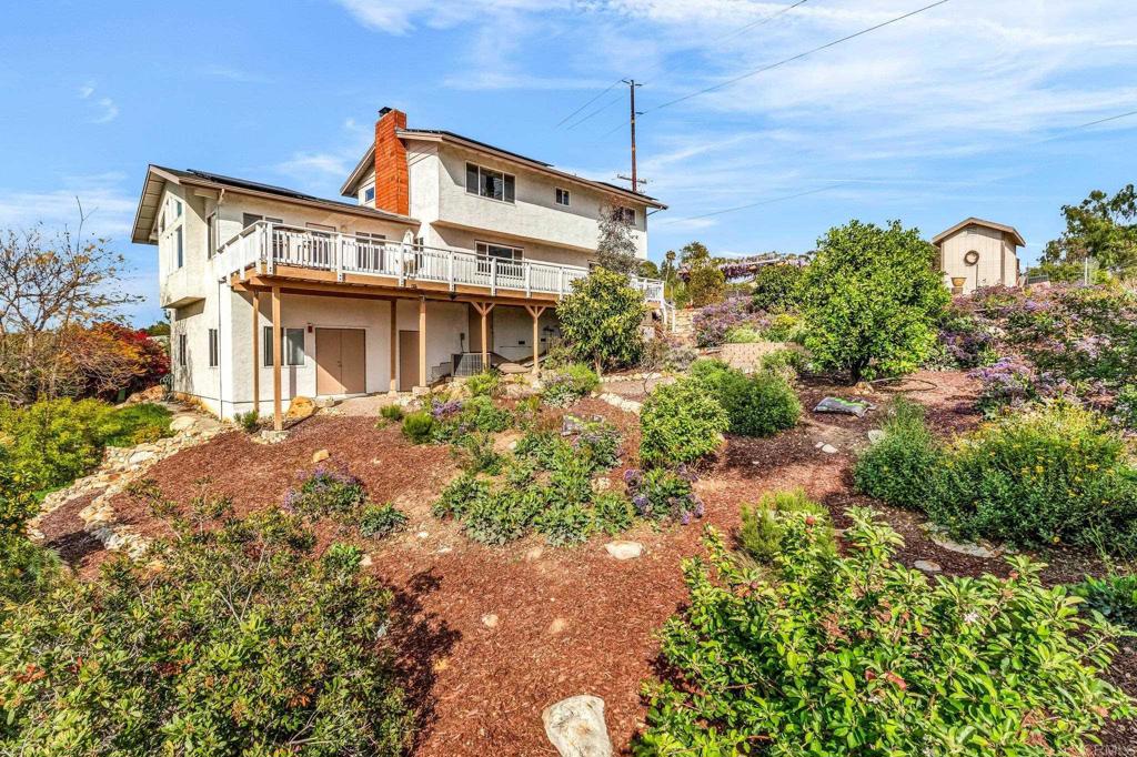 13501 Melissa Lane Poway, CA 92064 - Photo 53 of 62 a front view of a house with garden