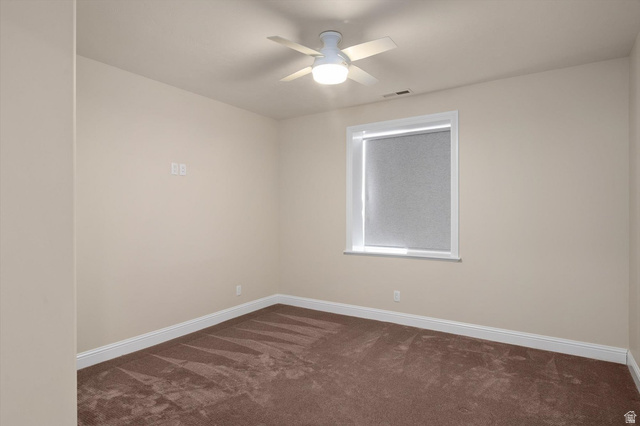 1456 Firelight Way Sandy, UT 84092 - Photo 14 of 22 Spacious room featuring neutral painted walls, brown carpet flooring, and white baseboards