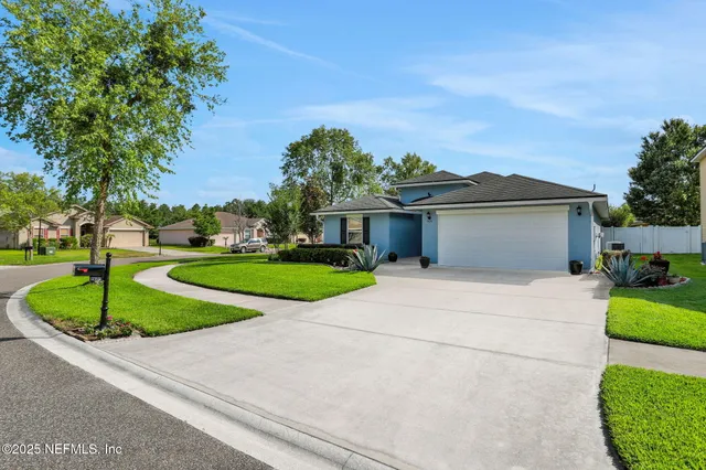 front view of a house with a yard