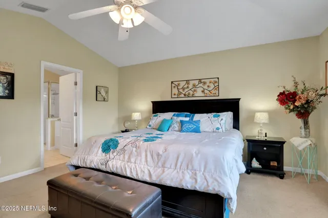 a spacious bathroom with a granite countertop sink a mirror and shower