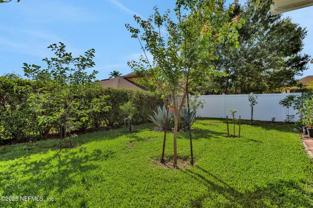 an aerial view of a house having yard