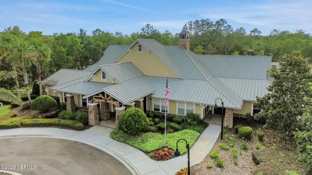 an outdoor space with furniture and garden