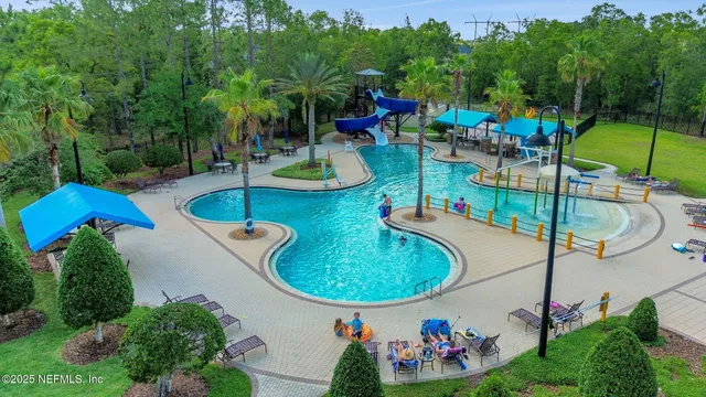 a view of a two chairs in the backyard