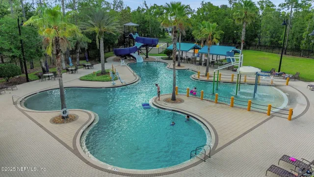 swimming pool view with a backyard space