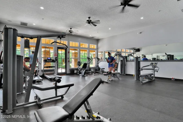 an aerial view of a swimming pool patio and outdoor seating