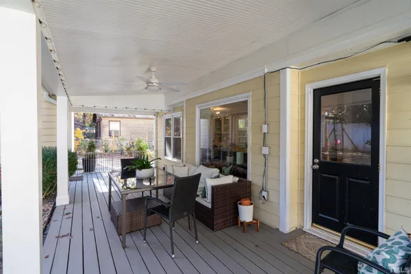 a view of a porch with wooden floor