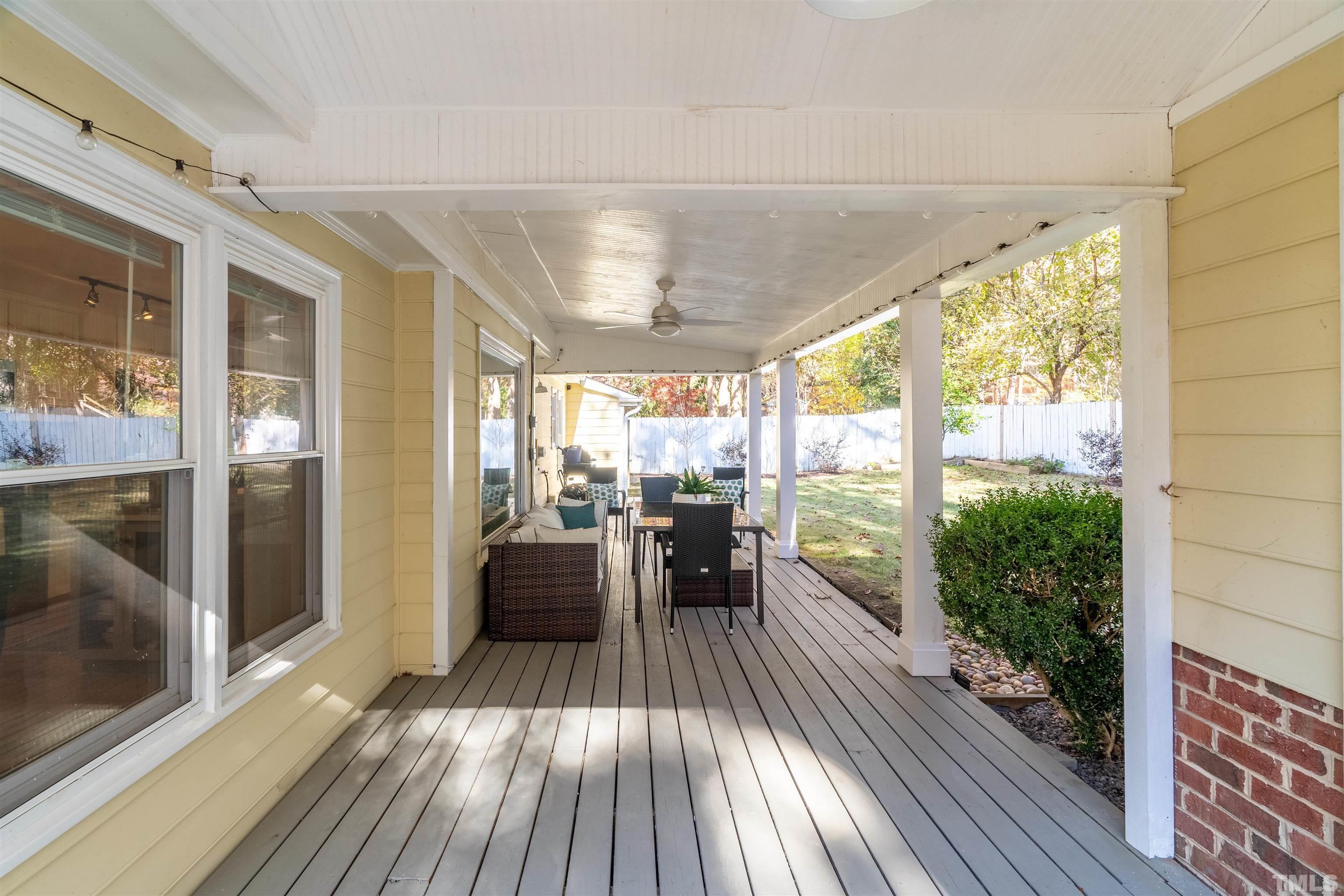 7304 Ray Road Raleigh, NC 27613 - Photo 27 of 30 a view of a porch with wooden floor