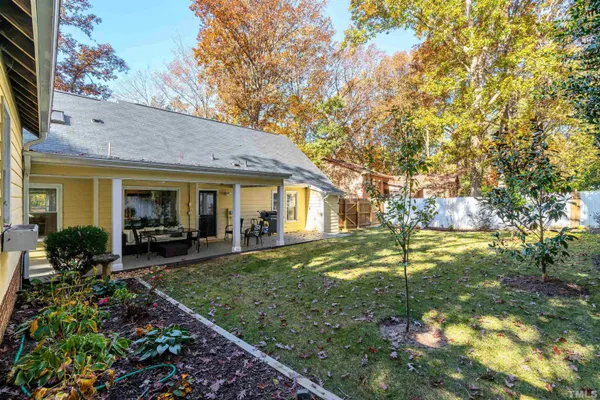 a view of a house with a yard patio and a yard