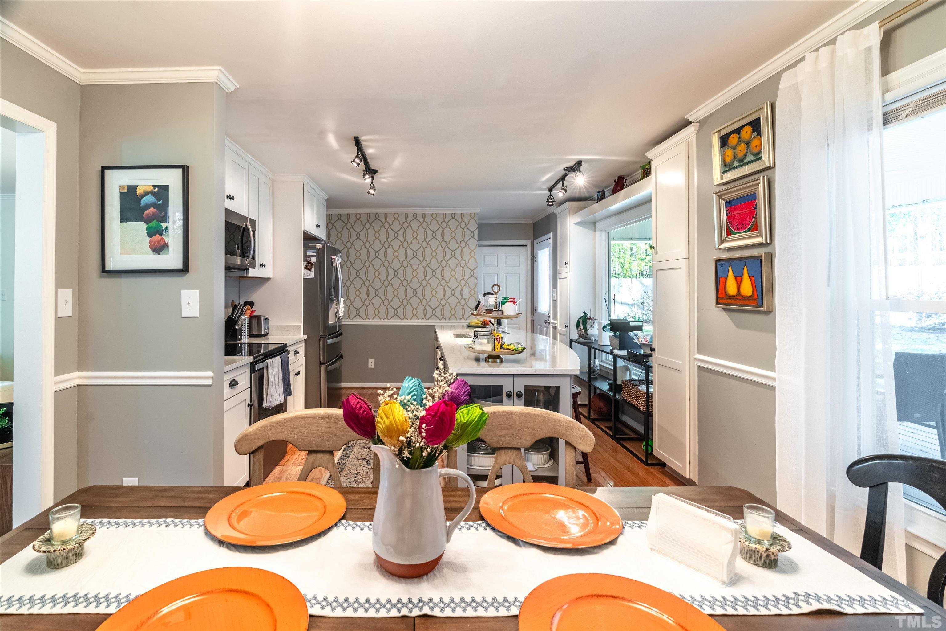 7304 Ray Road Raleigh, NC 27613 - Photo 7 of 30 a view of a dining room with furniture