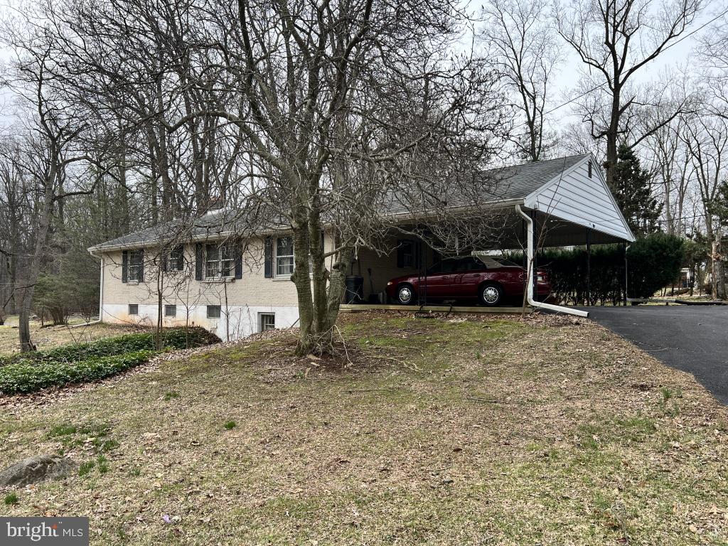 977 Locust Grove Road Middletown, PA 17057 - Photo 2 of 30 a front view of a house with a yard and garage